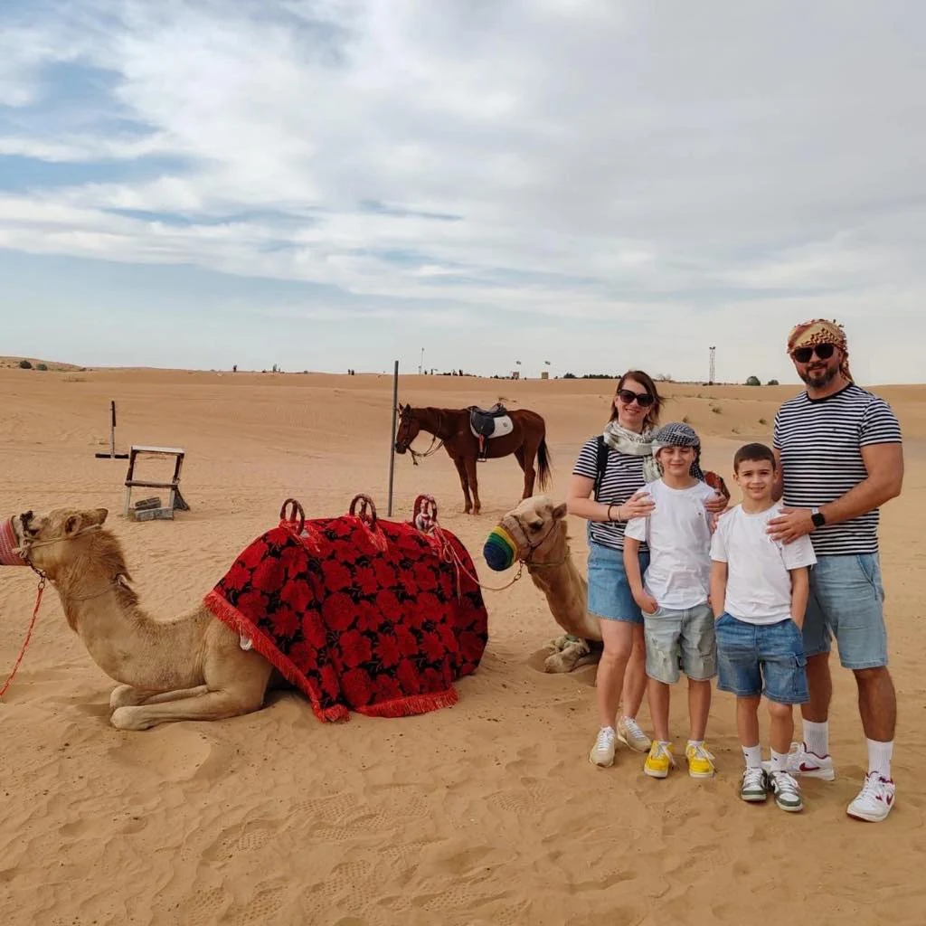 Family camel experience in the Dubai desert