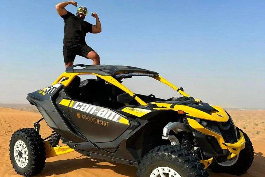 Can-Am buggy driving across the dunes
